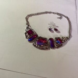 Paparazzi necklace with red glass stones.